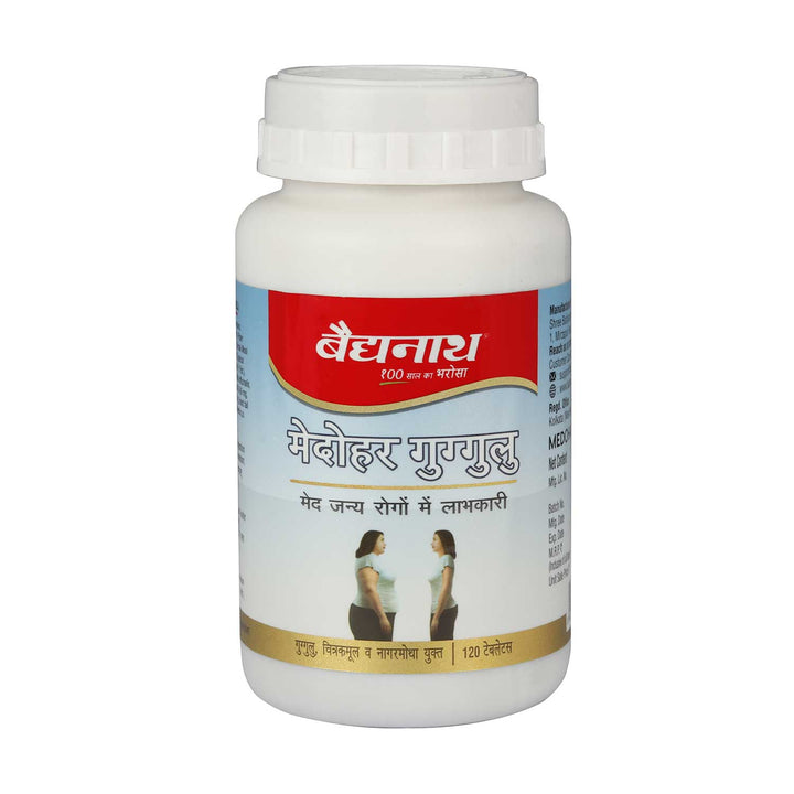 Baidyanath Medohar Guggulu bottle with a red and blue label. The label mentions its benefits for weight management and fat-related disorders, showing an image of a person before and after weight reduction. The bottle contains 120 tablets and is labeled as an Ayurvedic remedy.